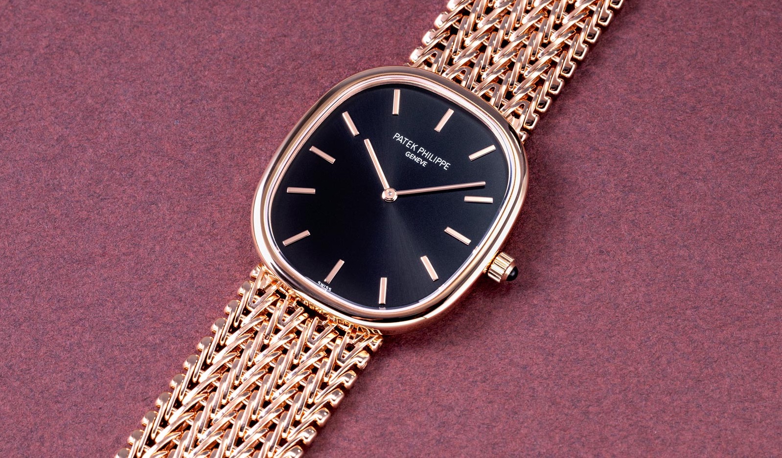 Patek Philippe Golden Ellipse ref. 5738/1R-001 in rose gold with black sunburst dial on rose gold chain-style bracelet